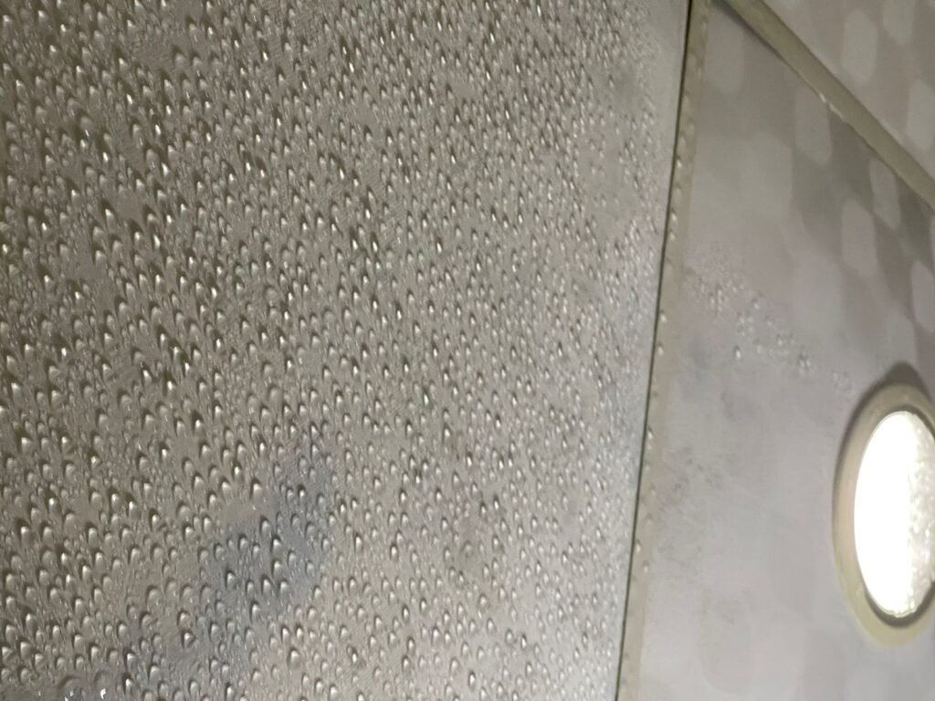 very high humidity in the kitchen causing condensation on metal ceiling tiles