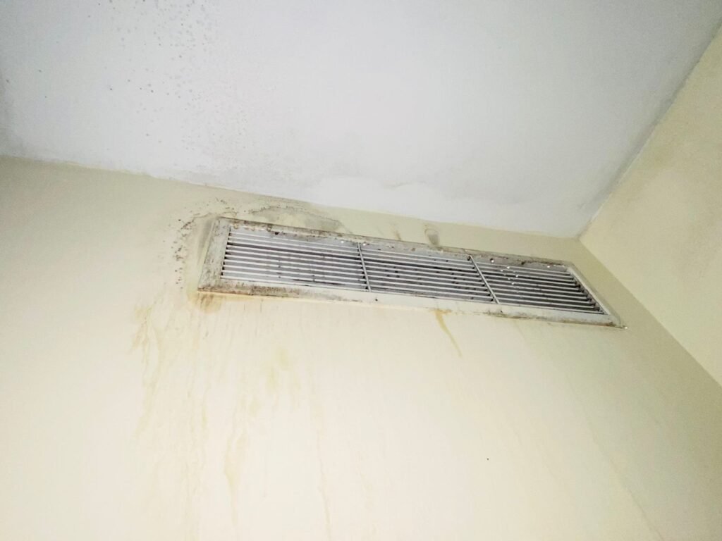condensation on ac grills with mold on wall
